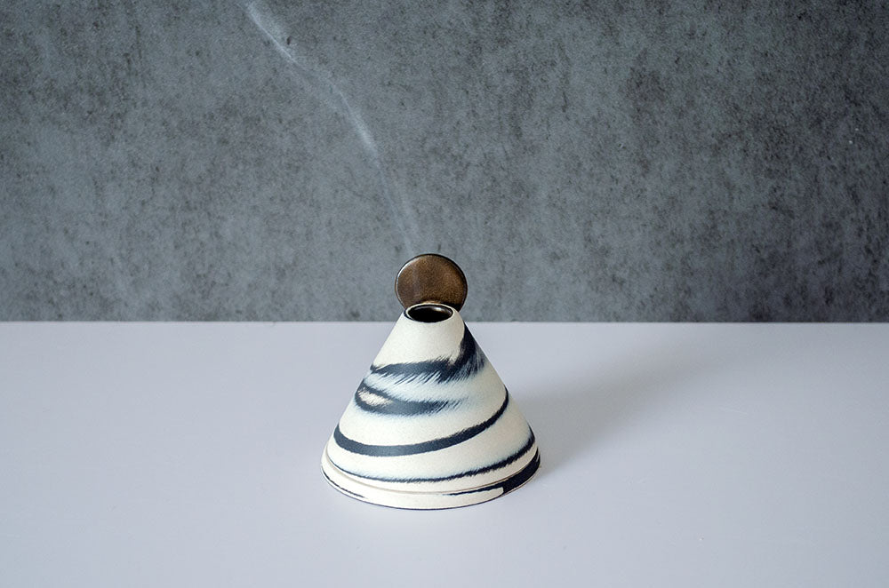 Incense holder with rusty moon on mountain